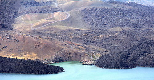 Aerial view of lake by mountain