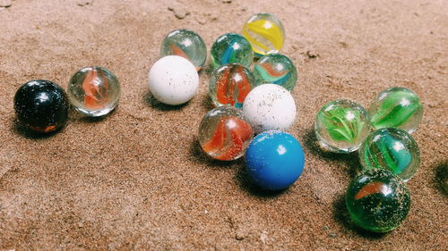 High angle view of marbles at beach