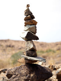 Stack of rocks against sky