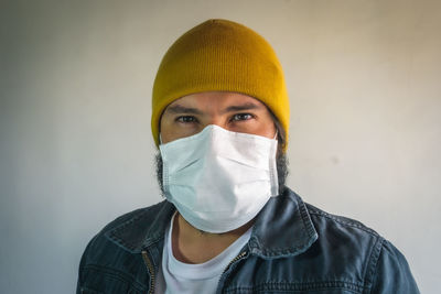 Portrait of mid adult man against white background