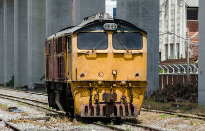 Train on railroad tracks in city