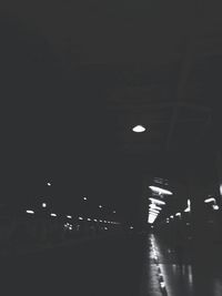 Illuminated lights against sky at night