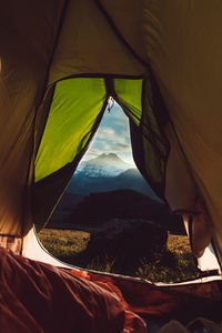 Mountains seen through tent at sunset