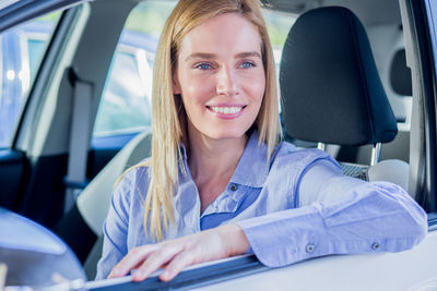 Close-up of woman sitting car