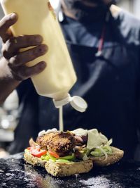 Midsection of man holding food