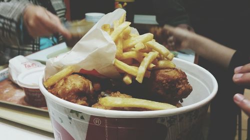 Close-up of hand holding burger