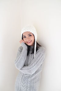 Portrait of a smiling young woman in snow