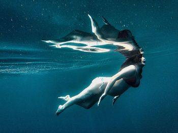 Woman swimming in sea