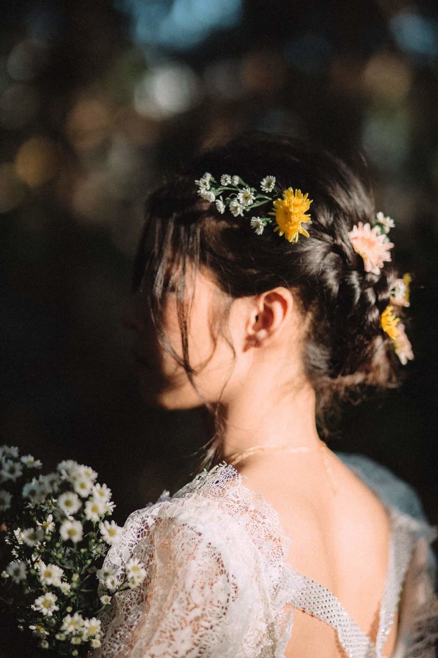 flower, flowering plant, plant, one person, women, lifestyles, real people, young adult, focus on foreground, portrait, nature, newlywed, leisure activity, adult, wedding dress, headshot, wedding, hair, celebration, wearing flowers, hairstyle, outdoors, flower head