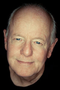 Close-up portrait of smiling mid adult man