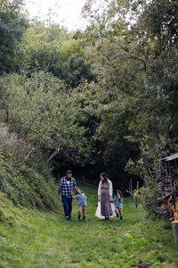 Family with two kids walking in the countryside