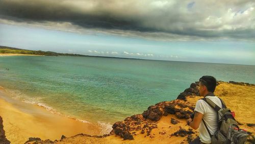 Scenic view of sea against cloudy sky