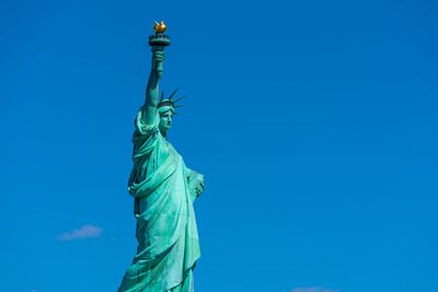 Statue of liberty against clear blue sky