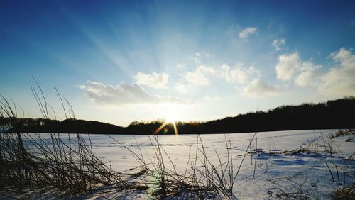 Scenic view of lake against sky during sunset