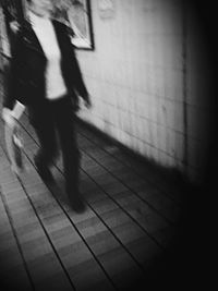 Shadow of woman on wall