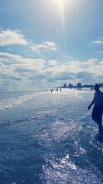 Scenic view of sea against sky on sunny day