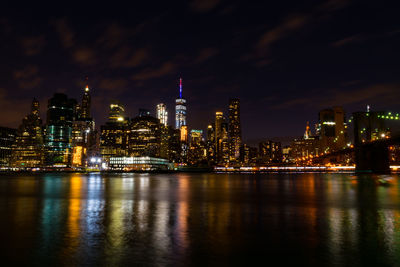 Illuminated city at waterfront