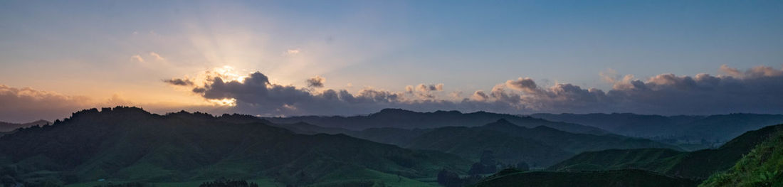 Panoramic view of mountains against sky during sunset