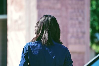 Rear view of woman standing outdoors