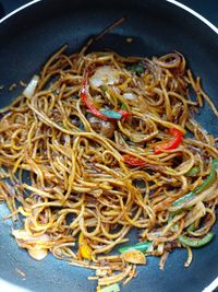 High angle view of noodles in frying pan