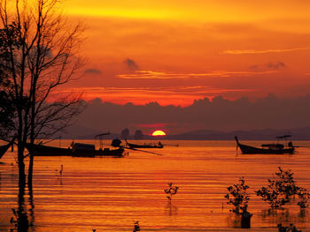 Scenic view of sea against orange sky