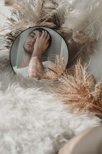 Portrait of young man sleeping in bed