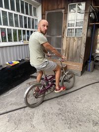 Full length of man riding bicycle