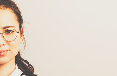 Portrait of a beautiful young woman over white background