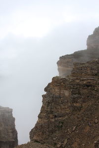 Rock formations on mountain against sky