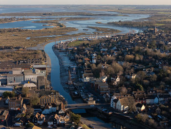 High angle view of townscape by sea