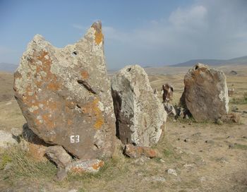 Close-up of stone wall against sky