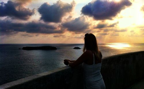 Scenic view of sea against cloudy sky