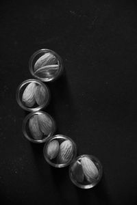 High angle view of wineglass on table against black background