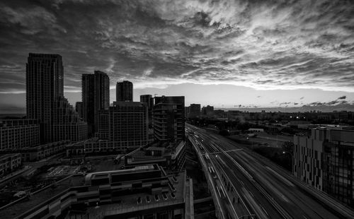 High angle view of buildings in city against sky