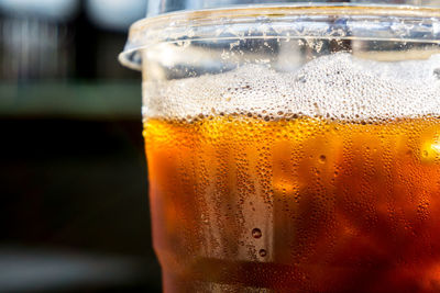 Close-up of beer glass on table