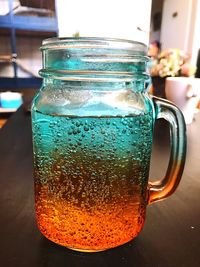 Close-up of drink in glass jar on table