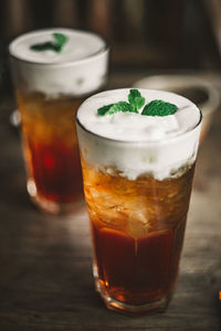 Close-up of oolong tea with white cream cheese on top