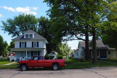 House by trees against sky