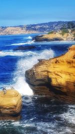 Scenic view of sea against blue sky