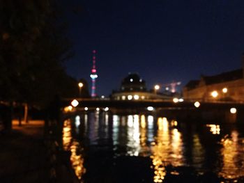 Reflection of illuminated buildings in water at night