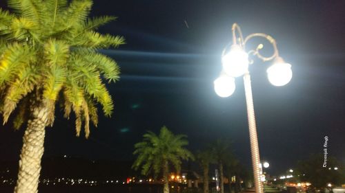 Low angle view of illuminated lights at night