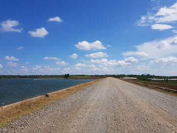 Road by land against sky