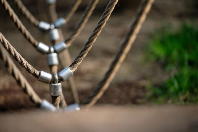 High angle view of chain swing hanging on field