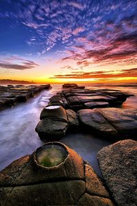 Scenic view of sea against sky during sunset