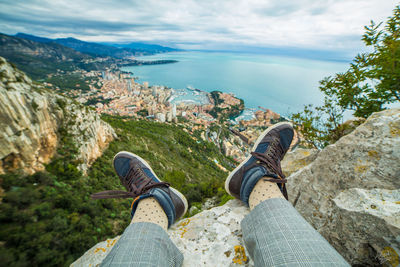 Low section of woman legs against sky