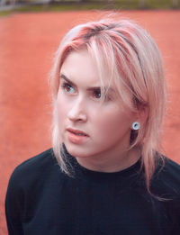 Close-up of thoughtful teenage girl looking away