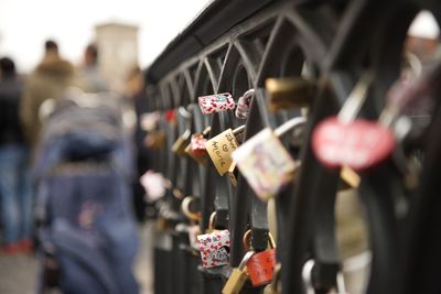 Close-up of padlocks hanging on heart shape