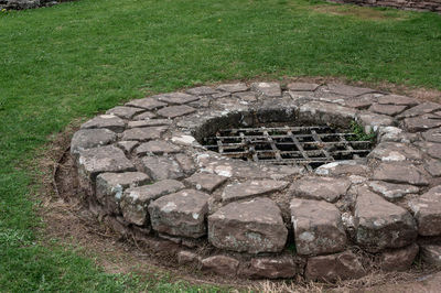 High angle view of manhole on field