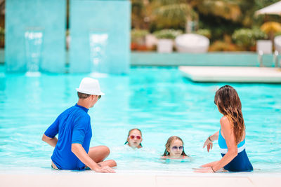 Family enjoying in swimming pool