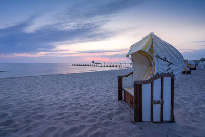 A beach chair at the beach at sunrise